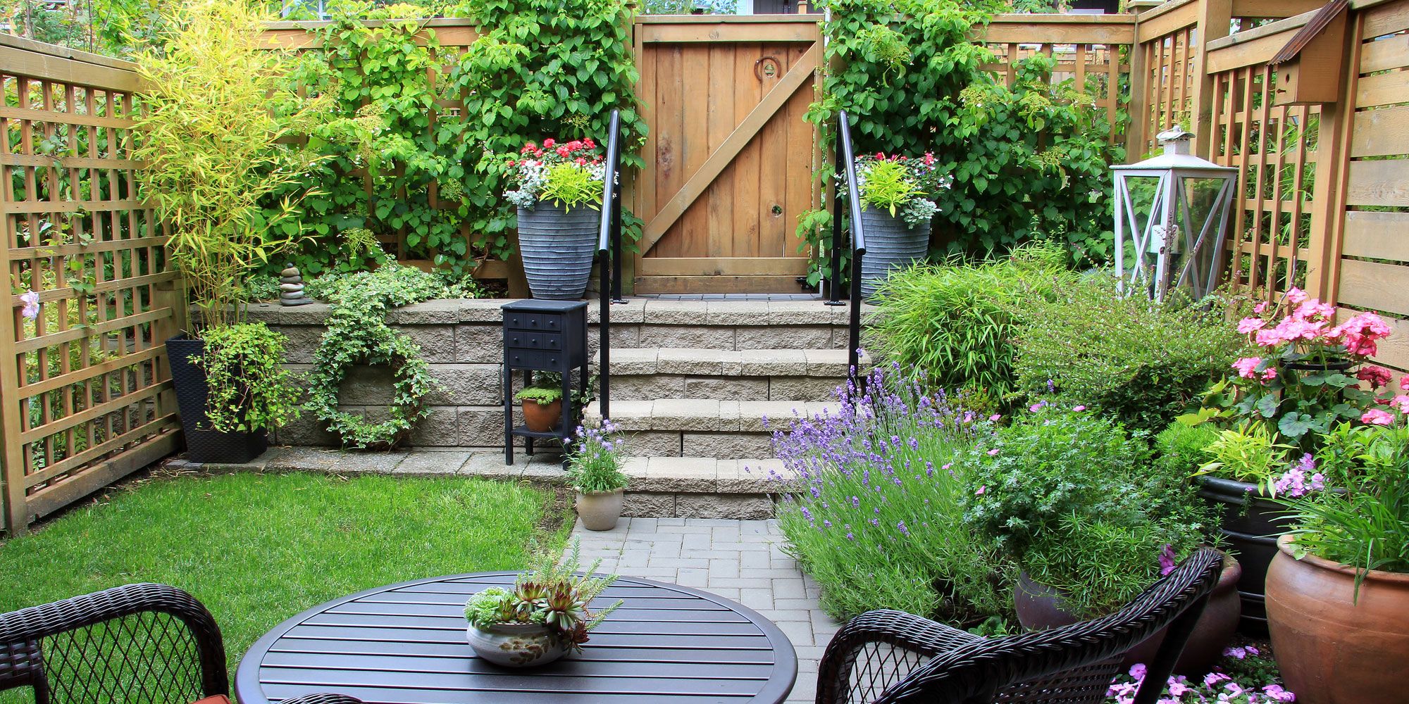 Landscaping services in Solihull - beautifully designed back garden with pathway and decorative steps